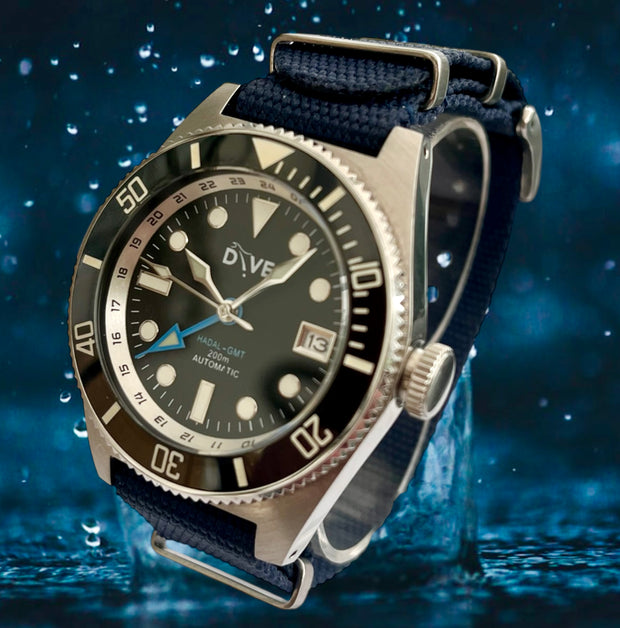 HAND-BUILT GMT DIVERS WATCH - HADAL'65 showcased on a premium NATO strap against a water backdrop.