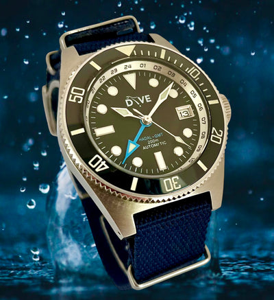 HAND-BUILT GMT DIVERS WATCH - HADAL'65 on a Navy NATO strap with water droplets in the background.